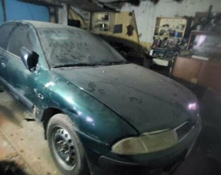 Зеленый Мицубиси Харизма, объемом двигателя 1.8 л и пробегом 350 тыс. км за 2600 $, фото 1 на Automoto.ua