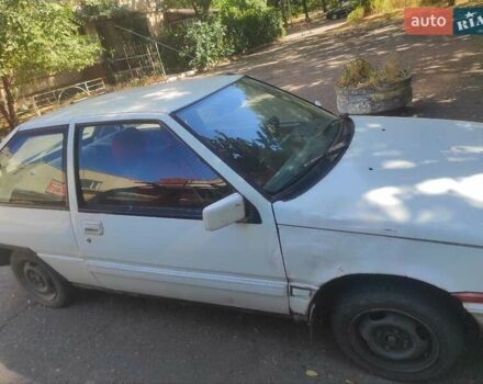 Белый Мицубиси Кольт, объемом двигателя 1.18 л и пробегом 300 тыс. км за 1000 $, фото 1 на Automoto.ua