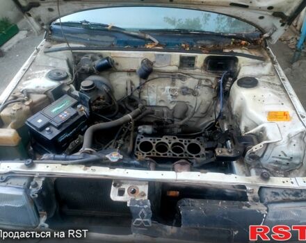 Белый Мицубиси Кольт, объемом двигателя 1.2 л и пробегом 245 тыс. км за 400 $, фото 4 на Automoto.ua