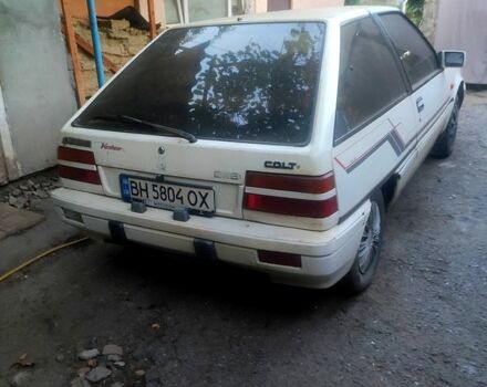 Белый Мицубиси Кольт, объемом двигателя 1.2 л и пробегом 245 тыс. км за 400 $, фото 1 на Automoto.ua