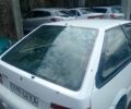Белый Мицубиси Кольт, объемом двигателя 1 л и пробегом 300 тыс. км за 561 $, фото 1 на Automoto.ua