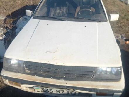 Белый Мицубиси Кольт, объемом двигателя 1.2 л и пробегом 215 тыс. км за 284 $, фото 1 на Automoto.ua