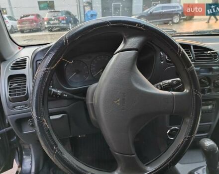 Чорний Міцубісі Кольт, об'ємом двигуна 1.3 л та пробігом 299 тис. км за 800 $, фото 11 на Automoto.ua
