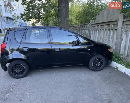Черный Мицубиси Кольт, объемом двигателя 1.3 л и пробегом 259 тыс. км за 4600 $, фото 6 на Automoto.ua