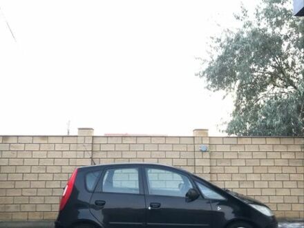 Черный Мицубиси Кольт, объемом двигателя 1.3 л и пробегом 234 тыс. км за 3999 $, фото 1 на Automoto.ua