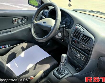 Красный Мицубиси Кольт, объемом двигателя 1.3 л и пробегом 102 тыс. км за 1300 $, фото 6 на Automoto.ua