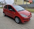 Красный Мицубиси Кольт, объемом двигателя 1.33 л и пробегом 241 тыс. км за 2850 $, фото 2 на Automoto.ua
