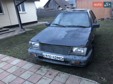 Серый Мицубиси Кольт, объемом двигателя 1.5 л и пробегом 290 тыс. км за 399 $, фото 1 на Automoto.ua