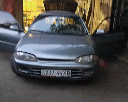 Серый Мицубиси Кольт, объемом двигателя 1.3 л и пробегом 240 тыс. км за 900 $, фото 1 на Automoto.ua