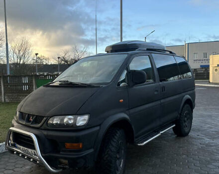 Черный Мицубиси Делика, объемом двигателя 3 л и пробегом 184 тыс. км за 18700 $, фото 1 на Automoto.ua