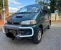 Красный Мицубиси Делика, объемом двигателя 2.8 л и пробегом 135 тыс. км за 6450 $, фото 1 на Automoto.ua