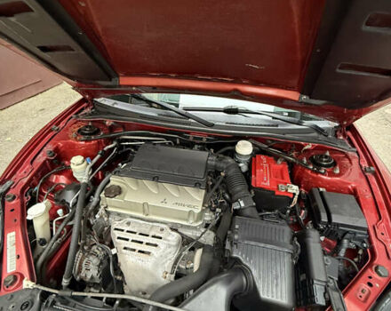 Оранжевый Мицубиси Эклипс, объемом двигателя 2.38 л и пробегом 97 тыс. км за 7500 $, фото 6 на Automoto.ua