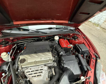 Оранжевый Мицубиси Эклипс, объемом двигателя 2.38 л и пробегом 97 тыс. км за 7500 $, фото 7 на Automoto.ua