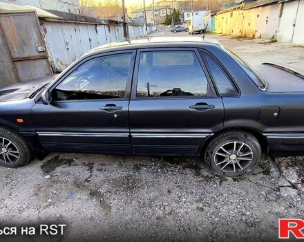 Черный Мицубиси Галант, объемом двигателя 1.8 л и пробегом 300 тыс. км за 1800 $, фото 3 на Automoto.ua