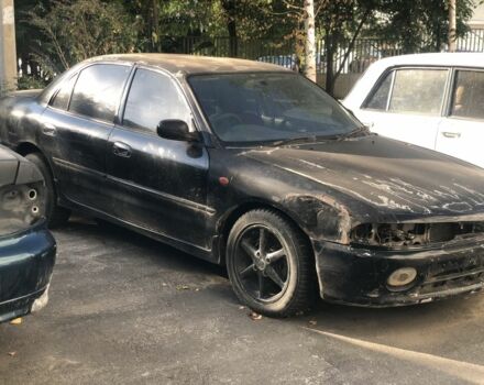 Черный Мицубиси Галант, объемом двигателя 2 л и пробегом 84 тыс. км за 900 $, фото 1 на Automoto.ua