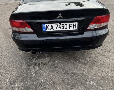 Черный Мицубиси Галант, объемом двигателя 2 л и пробегом 164 тыс. км за 5000 $, фото 1 на Automoto.ua