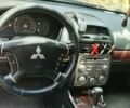 Черный Мицубиси Галант, объемом двигателя 2.38 л и пробегом 322 тыс. км за 5750 $, фото 1 на Automoto.ua