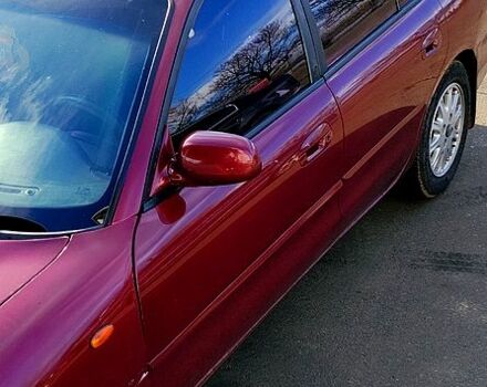 Красный Мицубиси Галант, объемом двигателя 2 л и пробегом 297 тыс. км за 2900 $, фото 1 на Automoto.ua