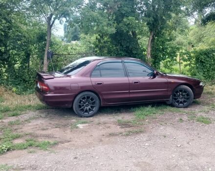 Красный Мицубиси Галант, объемом двигателя 2 л и пробегом 275 тыс. км за 2200 $, фото 1 на Automoto.ua