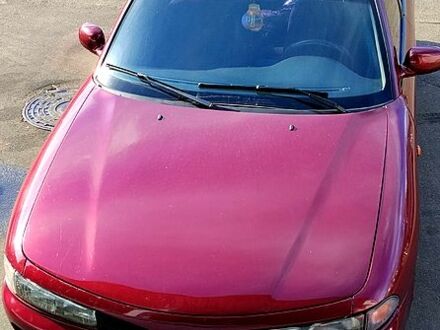 Красный Мицубиси Галант, объемом двигателя 2 л и пробегом 297 тыс. км за 2900 $, фото 1 на Automoto.ua