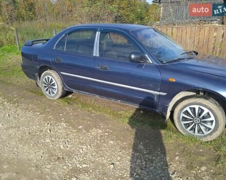 Синий Мицубиси Галант, объемом двигателя 2 л и пробегом 111 тыс. км за 700 $, фото 1 на Automoto.ua