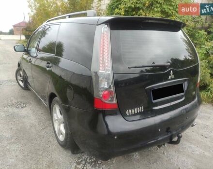 Черный Мицубиси Грандис, объемом двигателя 2 л и пробегом 309 тыс. км за 5400 $, фото 6 на Automoto.ua