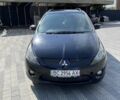 Черный Мицубиси Грандис, объемом двигателя 2.38 л и пробегом 300 тыс. км за 6000 $, фото 1 на Automoto.ua