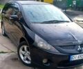 Черный Мицубиси Грандис, объемом двигателя 2.4 л и пробегом 300 тыс. км за 4400 $, фото 1 на Automoto.ua
