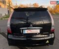 Черный Мицубиси Грандис, объемом двигателя 2.38 л и пробегом 197 тыс. км за 5299 $, фото 4 на Automoto.ua