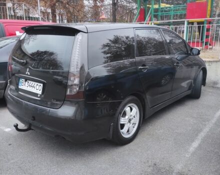 Черный Мицубиси Грандис, объемом двигателя 2.4 л и пробегом 320 тыс. км за 5700 $, фото 1 на Automoto.ua