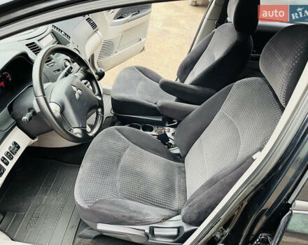 Черный Мицубиси Грандис, объемом двигателя 2.4 л и пробегом 188 тыс. км за 6800 $, фото 25 на Automoto.ua