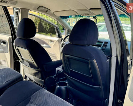 Черный Мицубиси Грандис, объемом двигателя 2.4 л и пробегом 121 тыс. км за 6450 $, фото 70 на Automoto.ua