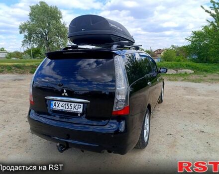 Черный Мицубиси Грандис, объемом двигателя 2.4 л и пробегом 241 тыс. км за 5400 $, фото 1 на Automoto.ua
