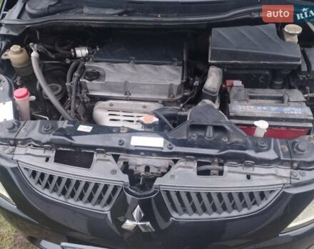Черный Мицубиси Грандис, объемом двигателя 2.4 л и пробегом 340 тыс. км за 5500 $, фото 4 на Automoto.ua