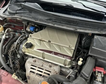 Красный Мицубиси Грандис, объемом двигателя 2.4 л и пробегом 300 тыс. км за 4850 $, фото 12 на Automoto.ua