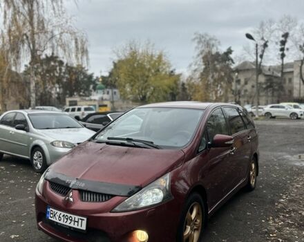 Красный Мицубиси Грандис, объемом двигателя 2.4 л и пробегом 300 тыс. км за 4850 $, фото 1 на Automoto.ua