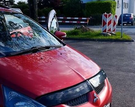 Красный Мицубиси Грандис, объемом двигателя 2.4 л и пробегом 220 тыс. км за 6100 $, фото 2 на Automoto.ua