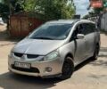 Серый Мицубиси Грандис, объемом двигателя 2.38 л и пробегом 281 тыс. км за 5500 $, фото 1 на Automoto.ua