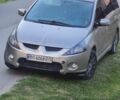 Серый Мицубиси Грандис, объемом двигателя 2.4 л и пробегом 243 тыс. км за 5600 $, фото 1 на Automoto.ua