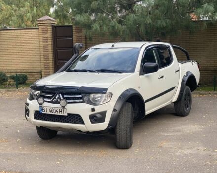 Белый Мицубиси Л 200, объемом двигателя 2.5 л и пробегом 169 тыс. км за 17000 $, фото 1 на Automoto.ua