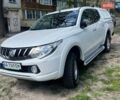 Белый Мицубиси Л 200, объемом двигателя 2.44 л и пробегом 220 тыс. км за 20000 $, фото 1 на Automoto.ua