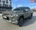 Белый Мицубиси Л 200, объемом двигателя 2.44 л и пробегом 313 тыс. км за 27000 $, фото 1 на Automoto.ua