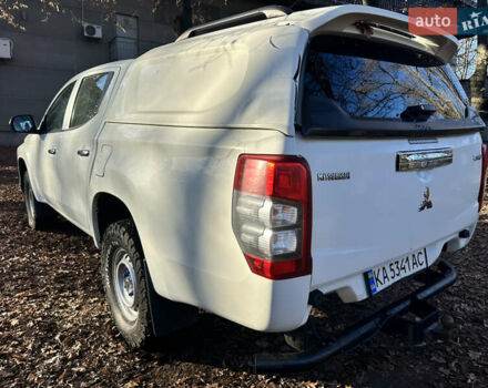 Белый Мицубиси Л 200, объемом двигателя 2.44 л и пробегом 312 тыс. км за 25000 $, фото 6 на Automoto.ua