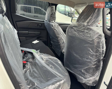 Белый Мицубиси Л 200, объемом двигателя 2.5 л и пробегом 1 тыс. км за 28962 $, фото 4 на Automoto.ua