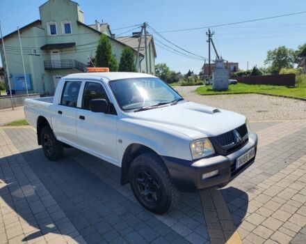 Белый Мицубиси Л 200, объемом двигателя 2.5 л и пробегом 175 тыс. км за 6778 $, фото 1 на Automoto.ua