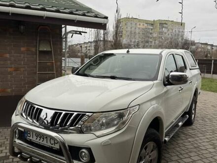 Белый Мицубиси Л 200, объемом двигателя 2.44 л и пробегом 213 тыс. км за 21347 $, фото 1 на Automoto.ua