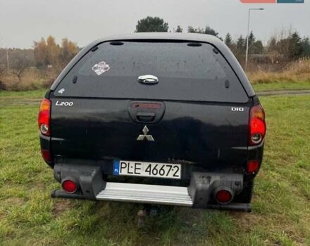 Черный Мицубиси Л 200, объемом двигателя 2.5 л и пробегом 236 тыс. км за 3700 $, фото 5 на Automoto.ua