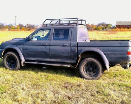 Черный Мицубиси Л 200, объемом двигателя 2.5 л и пробегом 200 тыс. км за 4000 $, фото 5 на Automoto.ua