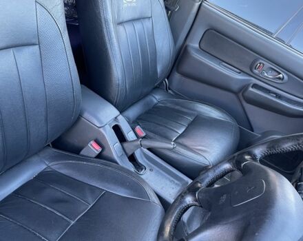 Черный Мицубиси Л 200, объемом двигателя 2.5 л и пробегом 220 тыс. км за 5299 $, фото 7 на Automoto.ua