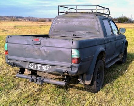 Черный Мицубиси Л 200, объемом двигателя 2.5 л и пробегом 200 тыс. км за 4000 $, фото 4 на Automoto.ua